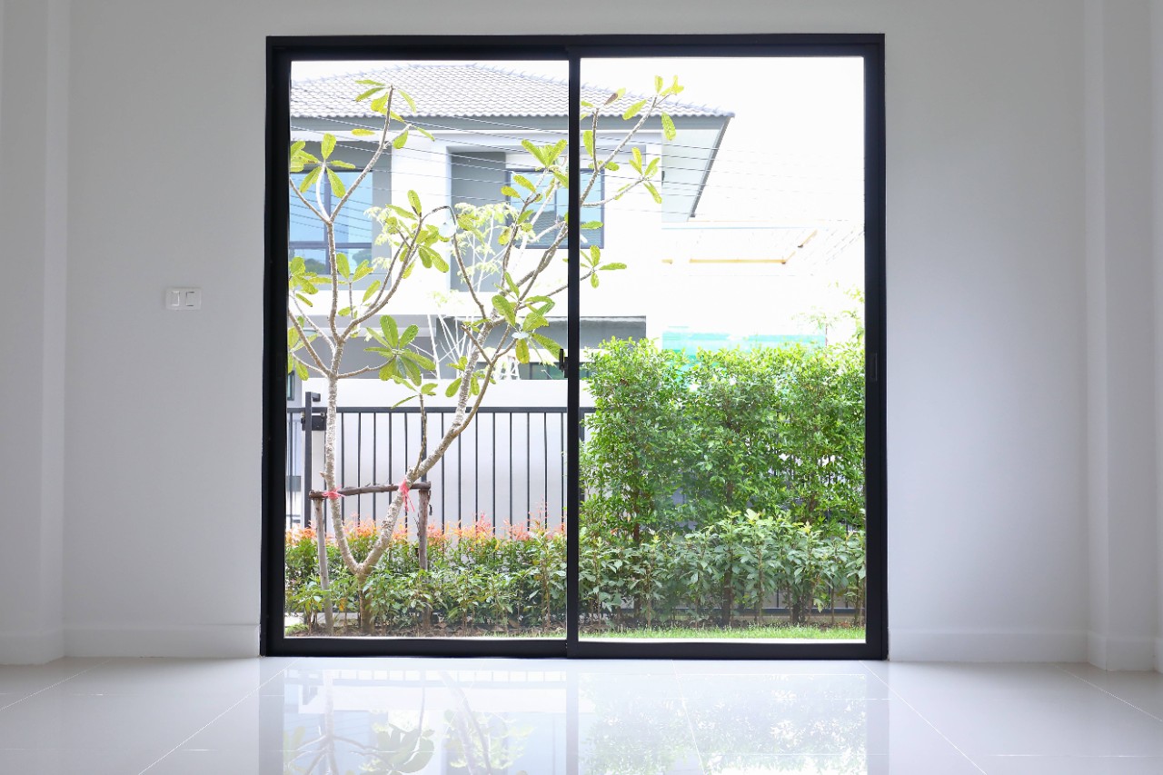 A sliding glass door that's ready for window treatments in Boynton, Florida (FL)
