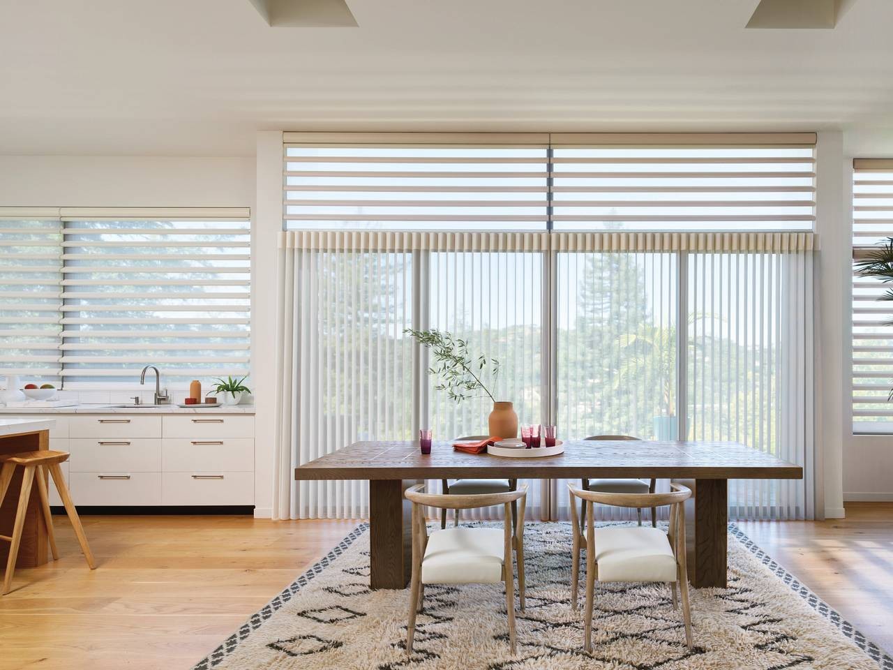 Modern kitchen with bright windows and Hunter Douglas Luminette® Privacy Sheers on the windows near Boynton Beach, FL