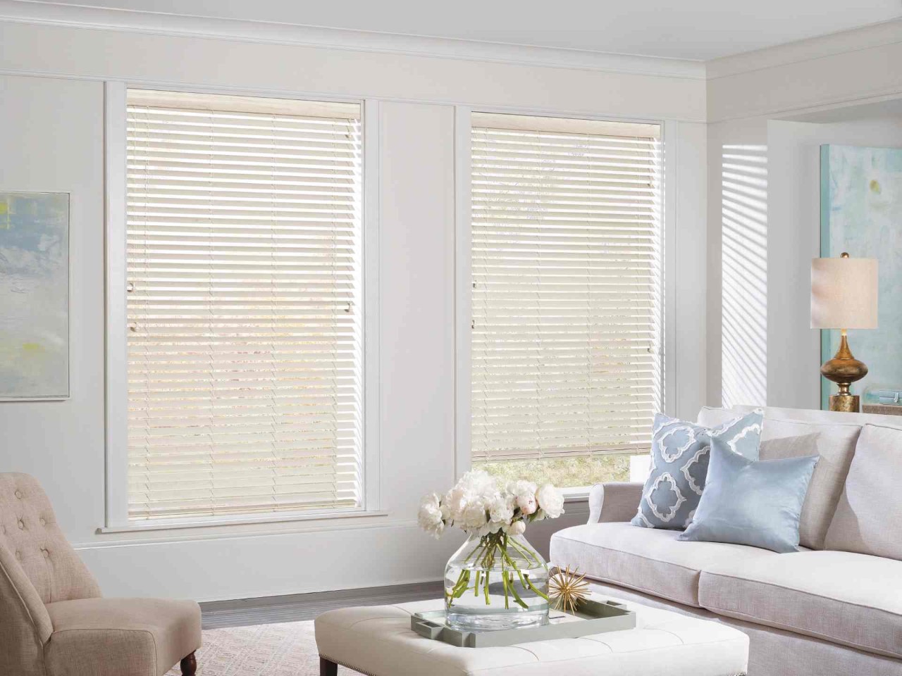 Hunter Douglas EverWood® Faux Wood blinds on windows in a light and airy living room at Enhancement Window Design near Boynton Beach, (FL)